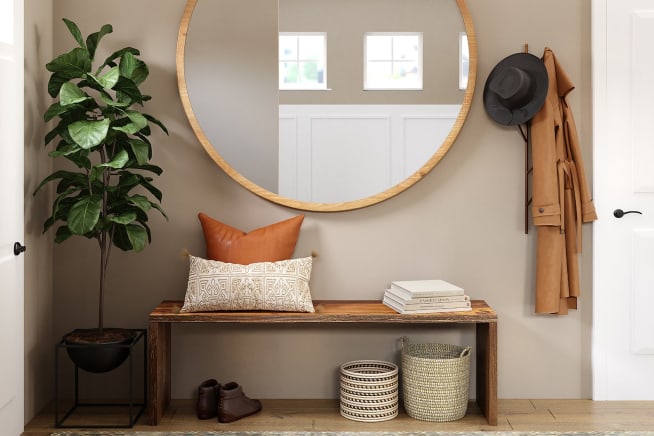 Medium sized fiddle leaf fig plant stands in a hallway